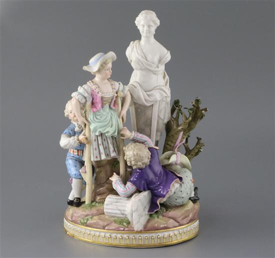 A Meissen group of children picking apples in a garden with a classical statue, late 19th century, H. 26.5cm